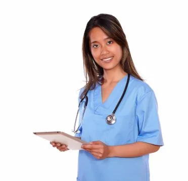 Charming asiatic nurse woman using her tablet pc Stock Photos