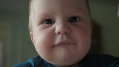 Charming baby, serious look Stock Footage 341630739
