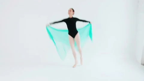 Charming ballerina demonstrates the elements of classical ballet with a bright Stock Footage 197751909