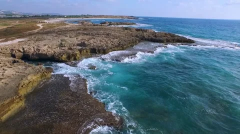 The charming beach! Azure waves are beating against the rocks. Stock Footage 55107362