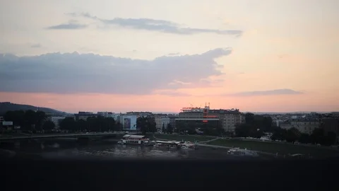 Charming beautiful view of bridge and city at sunset on summer evening of little Stock Footage 95448156