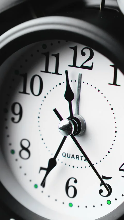 Charming black clock ticks. Time ticking on old fashioned alarm clock with bells Video stock 327450120