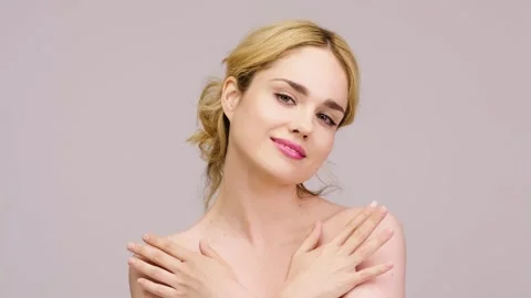 Charming blonde posing against a light background. Stock Footage 278491284