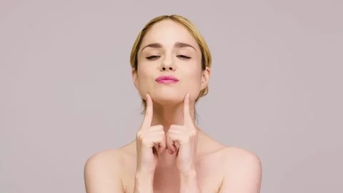 Charming blonde posing against a light background. Stock Footage 278491656