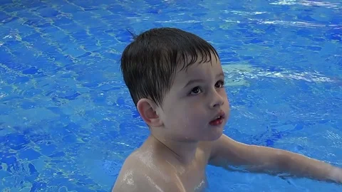 Charming boy in the pool Stock Footage 73441345