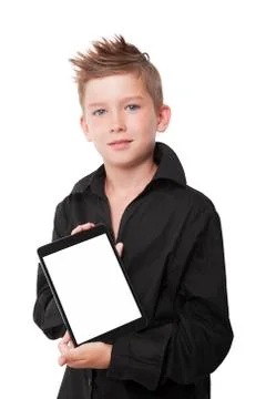 Charming boy showing tablet. Stock Photos
