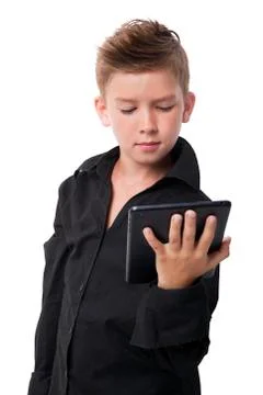 Charming boy with tablet. Stock Photos