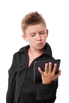 Charming boy with tablet. Stock Photos