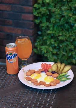 Charming breakfast setting featuring sunny-side-up eggs Stock Photos