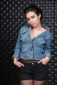 Charming brunette posing in the studio. Stock Photos