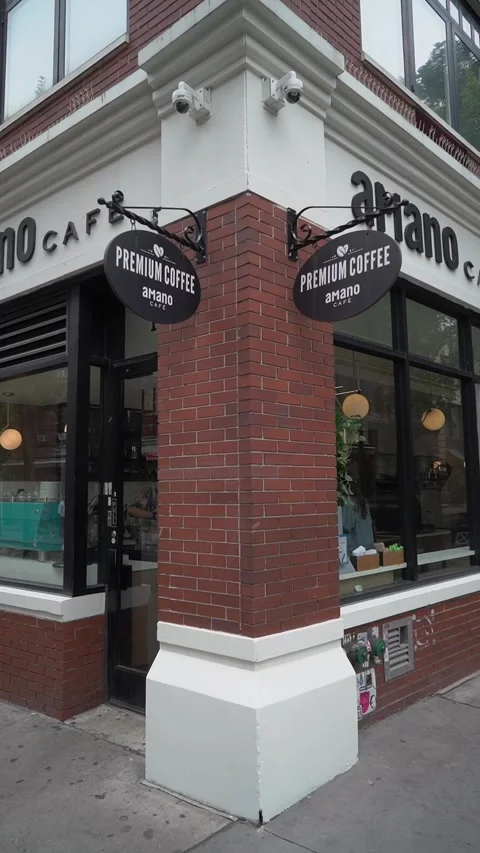 Charming Cafe Corner with Unique Signage in Urban Setting Stock Footage 295008046