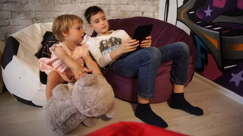 Charming children play with the tablet Stock Footage 76274097