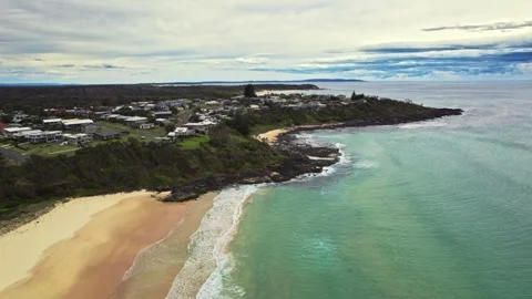 Charming Coastal Community Situated On Cliffs With Tranquil Waters And Lush Stock Footage 323794908