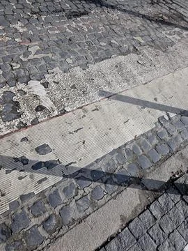 Charming Cobblestone Sidewalk With Unique Patterns and Textures Stock Photos