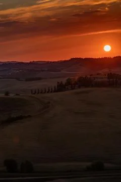 Charming colored tuscan sunset Stock Photos