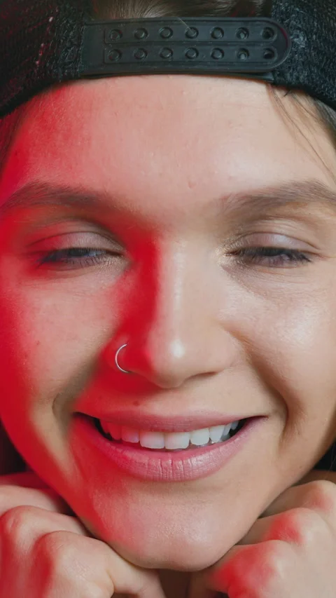 Charming confident positive satisfied stylish 25-aged girl with earring in nose  Stock Footage 329244635