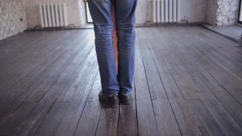 Charming couple is learning to dance in the studio Stock Footage 70200072