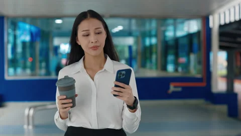 Charming Cute Busy Worker Going through the Train Station, Drinking Coffee Video stock 303894904