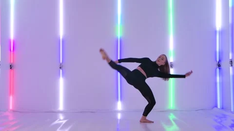 Charming dancer in black leotard performing acrobatic contemp dance elements Stock Footage 147553020