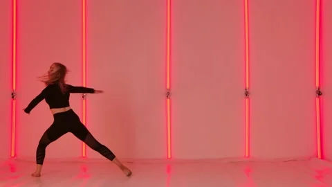 Charming dancer in black leotard performing acrobatic contemp dance elements Stock Footage 147553149