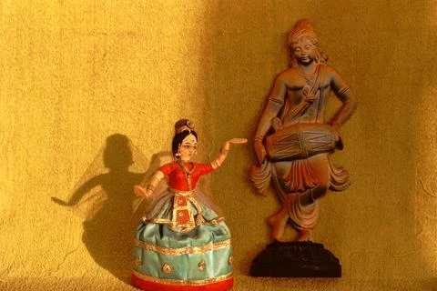 A charming doll setting of an Indian dancer with a shadow behind and drumbeat Stock Photos