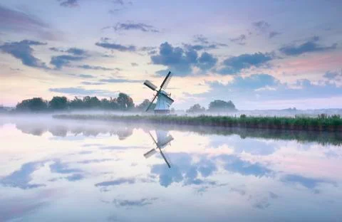 Charming Dutch windmill at dawn Stock Photos
