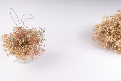Charming Easter Bunny Ears Decor with Pastel Dried Flowers and Rustic Bouqu.. Stock Photos