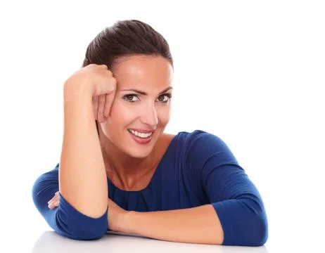 Charming female looking at you while smiling in white background Stock Photos
