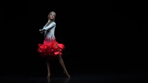 Charming girl dancing elements rumba, dark background. Slow motion Stock Footage 69796666