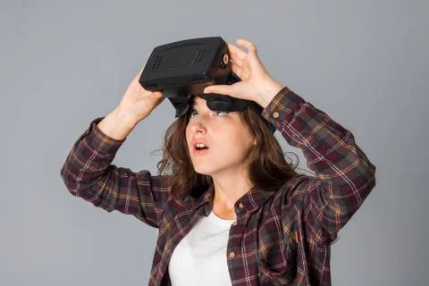 Charming girl testing virtual reality glasses Stock Photos