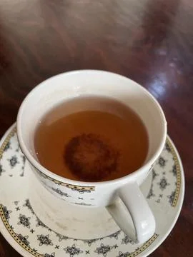 A charming green tea cup, elegantly crafted for enjoying soothing and refre.. Stock Photos