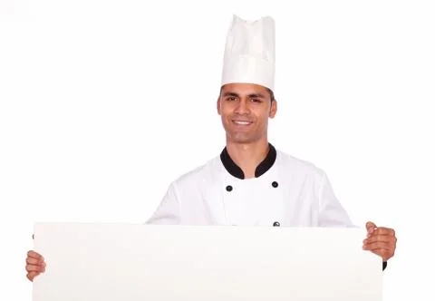 Charming guy chef holding a white placard Stock Photos