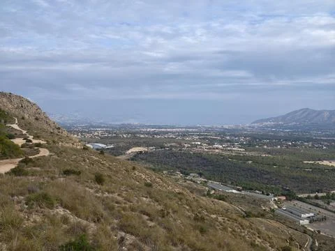 Charming hiking path through rocky terrain offering breathtaking views of n.. Photos