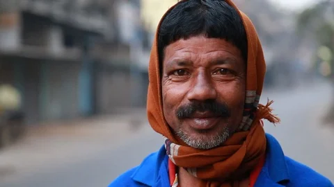 Charming Indian Man With Scarf Grins at Camera Stock Footage 129098448