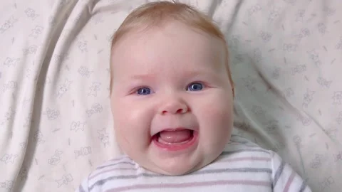 Charming Infant Smiles Happily at the Camera Stock Footage 314376814