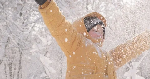 Charming kid throws snow up Stock Footage 229939798