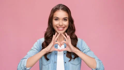 Charming lady express romantic heart with fingers appreciate feedback reaction Stock Footage 163361630