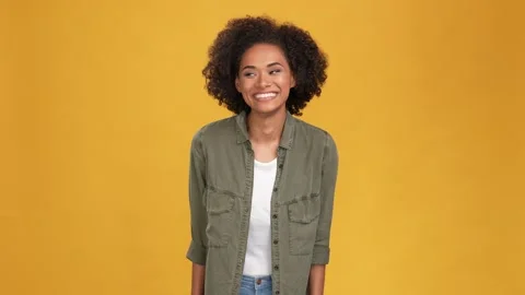 Charming lady touch curls dander lotion use isolated mustard color background Stock Footage 166161601