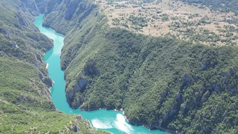 A charming lake surrounded by forests in the mountains of northern Montenegro Stock Footage 293099571