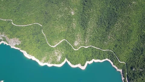 A charming lake surrounded by forests in the mountains of northern Montenegro Stock Footage 293099595