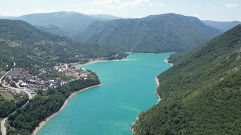 A charming lake surrounded by forests in the mountains of northern Montenegro Stock Footage 293099681