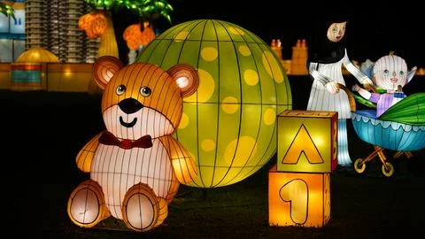 Charming Lantern Display with Teddy Bear and Family Figures Stock Photos