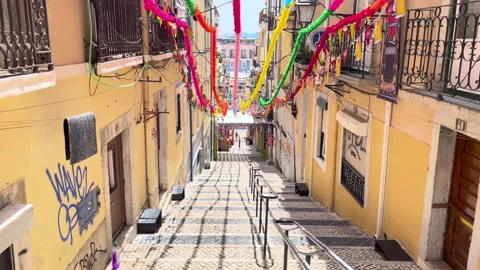 Charming Lisbon Staircase Lined With Decorated Buildings and Colorful Flags Stock Footage 316829378