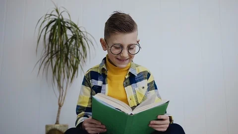 A charming little boy in glasses with Stock Video Pond5