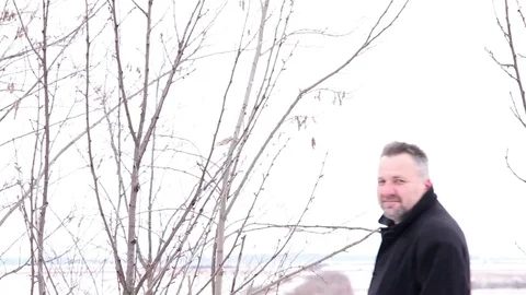Charming Man Walking Outdoor, Winter Time Stock Footage 100769787