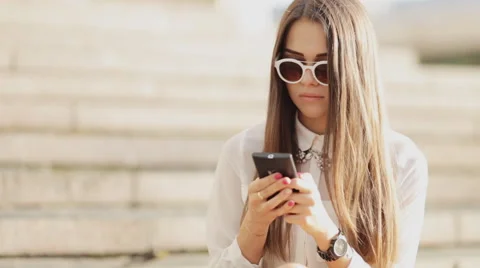 Charming model posing for the camera while sitting near the University Stock Footage 54218832