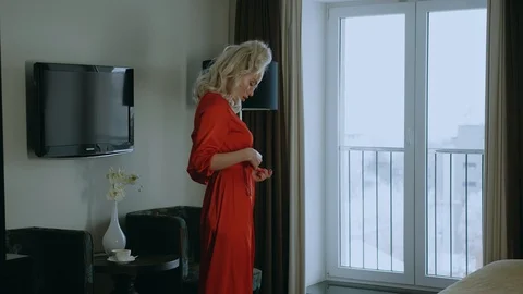 Charming model in a red robe. 스톡 동영상 101552476