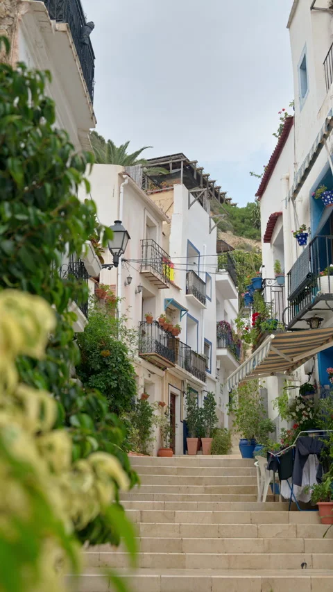 Charming narrow street with multiple steps in Benidorm Old Town, Spain. Vertical Stock Footage 317102562