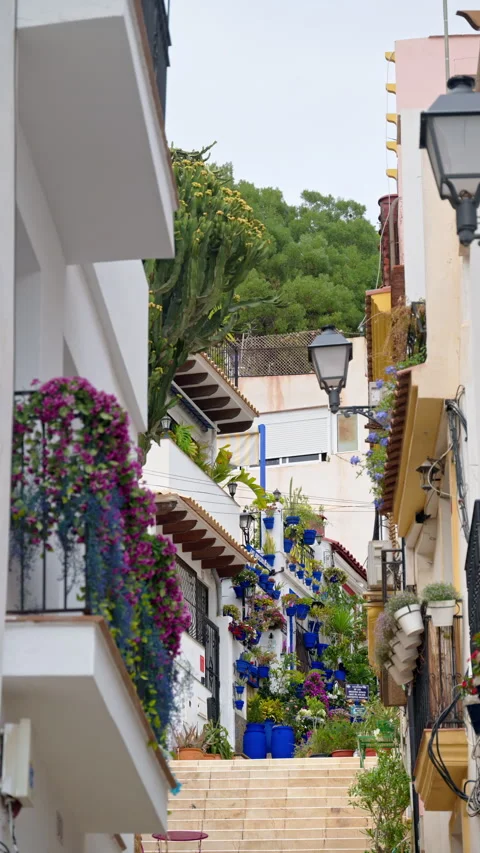 Charming narrow street with multiple steps in Benidorm Old Town, Spain. Vertical Stock Footage 317102874