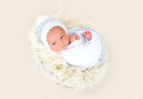 Charming newborn lying awake Stock Photos